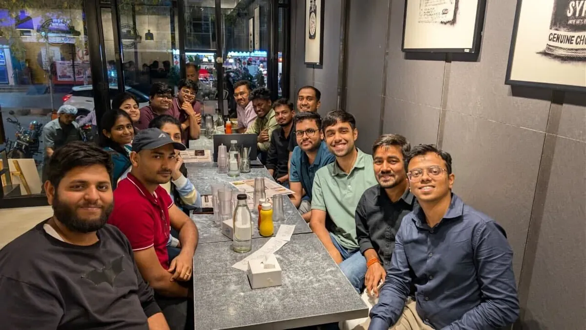 Team members sharing a meal at a restaurant