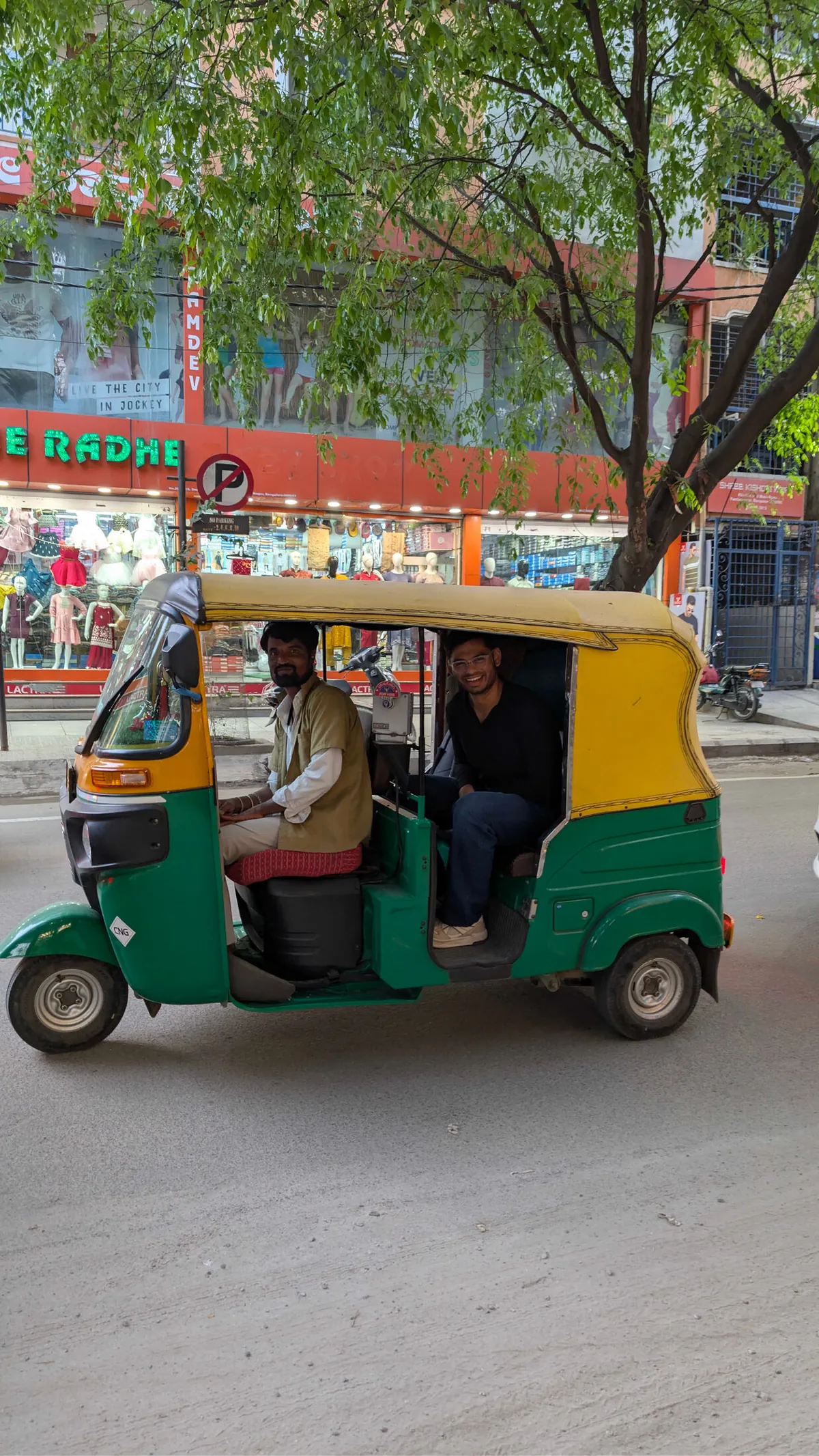 Colleagues riding an auto-rickshaw together